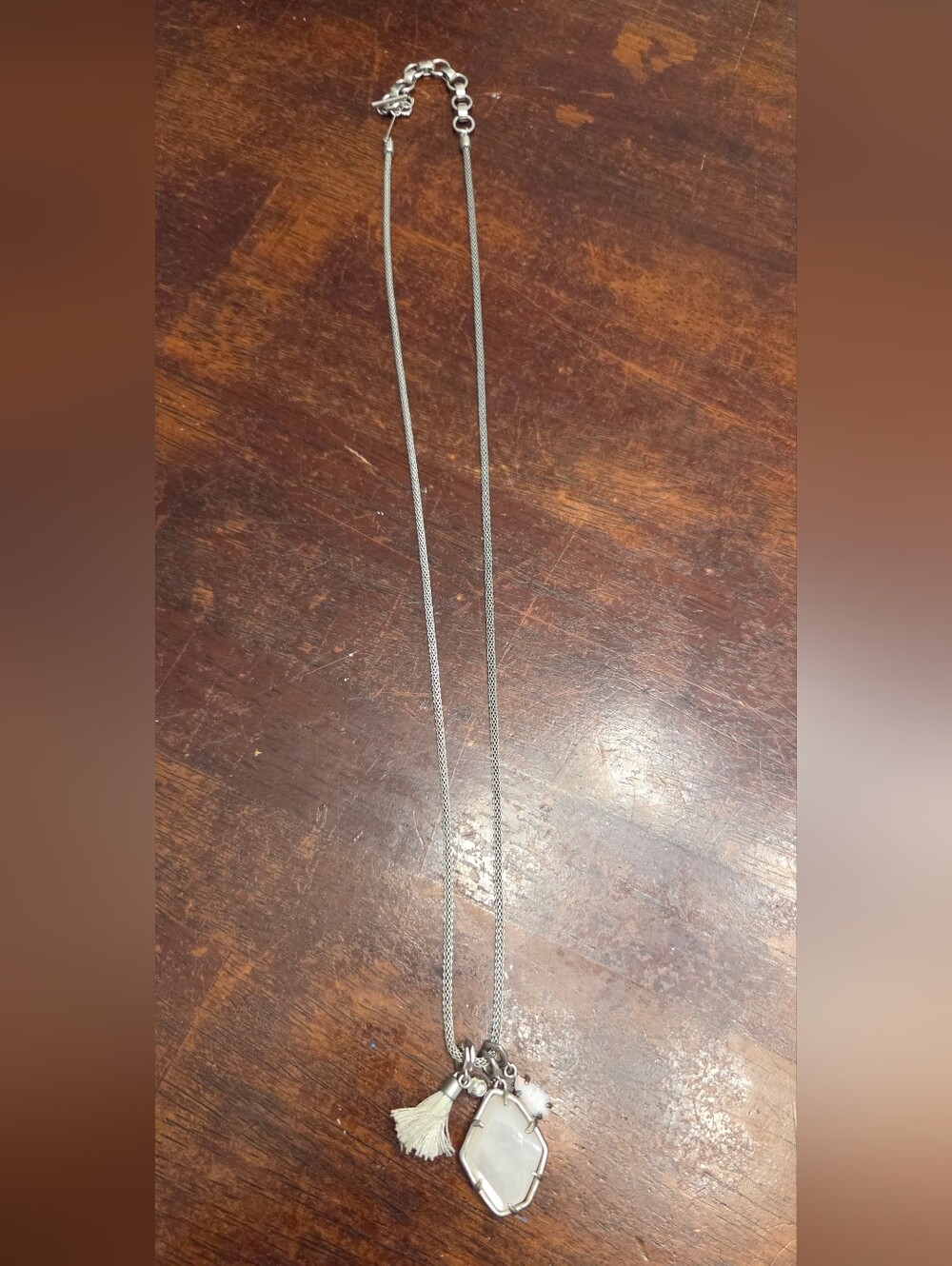 Kendra Scott Silver Necklace with White Pendant and Cream Tassel